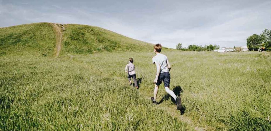 Boys running outdoors