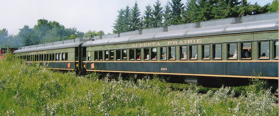 May 23 2026 2:00 pm - 8:00 pm This extra ordinary excursion will travel to Big Valley and spend an hour at this popular destination before reboarding the train for the return journey with a stop at the Country Hideaway including a full course buffet meal featuring a barbecued 6 to 8 oz Canadian AA steak, chuckwagon beans, baked potato, Caesar salad and dessert. This trip includes live entertainment in the coaches, time to visit and explore Big Valley including a fully restored 1912 Canadian Northern railway station, the blue church on the hill – St. Edmund’s, time to visit Granny’s Fudge Factory and All That Buzz, vintage automobiles, trucks and household artifacts at McAlister’s Garage Museum, and Big Valley’s world-class Hand-tool and Collectibles Museum. Payroll on board the train increases the danger of being hit by the Reynolds Raiders horse-mounted outlaw gang. Contact Alberta Prairie Railway for more details and to book!